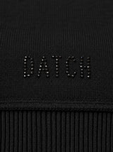 Maglia con scollo asimmetrico e strass