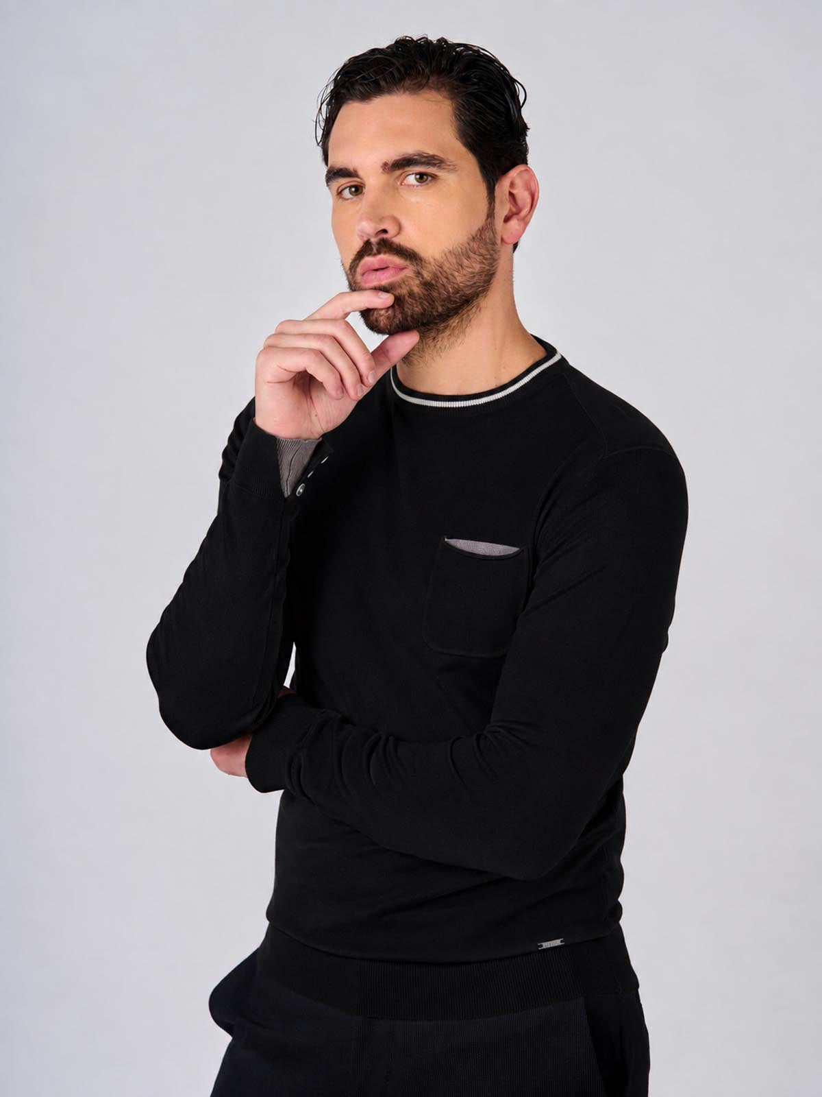 Maglia girocollo manica raglan con taschino