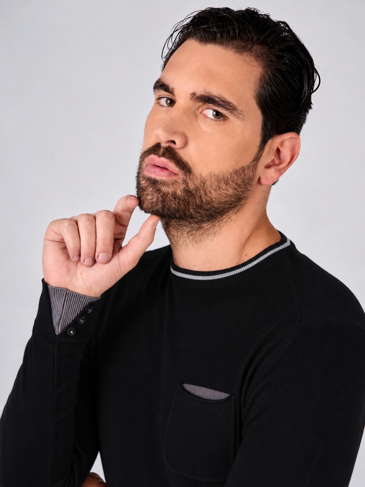 Maglia girocollo manica raglan con taschino