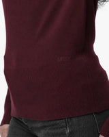 Maglia con scollo asimmetrico e strass