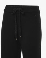 Pantaloni in maglia a zampa con bordi lurex