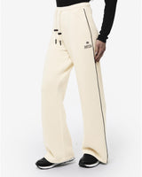 Pantaloni a gamba larga in scuba con piping in ecopelle