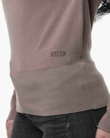 Maglia con scollo asimmetrico e strass