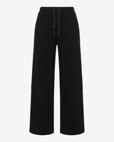 Pantaloni a gamba larga in scuba con piping in ecopelle